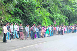 People waiting for buses as private bus operators go on strike at Shimla on Saturday.