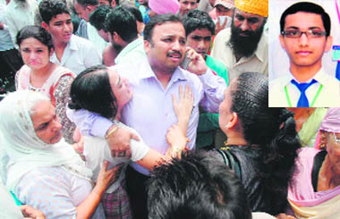 Sister of the victim being consoled by her relative at the accident site on the Tajpur road in Ludhiana on Saturday, (Inset) 16-year-old Mayank Jain.