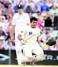 Umar Akmal reacts after hitting the final run at in London on Saturday