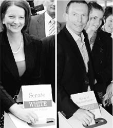 Australian Prime Minister Julia Gillard (left) and federal opposition leader Tony Abbott cast their votes on Saturday