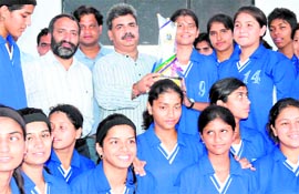 Doons girls team receive trophy of the Inter-School Basketball Championship in Haridwar on Sunday.