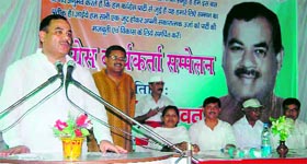 Opposition leader Harak Singh Rawat addresses a convention in Dehradun on Sunday.
