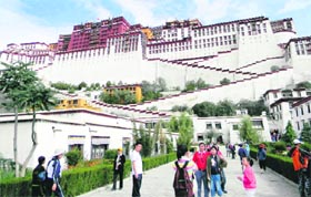 Visitors admire the majestic Potala Palace, winter abode of the Dalai Lama.