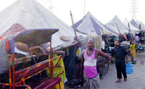 Residents of Old Usmanpur village at a makeshift camp after the Yamuna water entered their village in east Delhi on Monday.