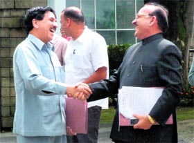 State BJP president Khimi Ram (left) greets Congress chief Kaul Singh Thakur on the last day of the monsoon session in Shimla on Monday.
