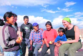 Dominika Lis, a Polish tourist, who is also a psychologist, interacts with a flood-hit family in Leh