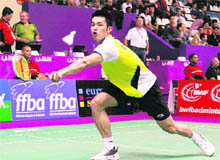 China's Lin Dan returns the shuttle during his match against Iran's Ali Shahhosseini in Paris on Sunday