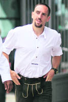 Franck Ribery of Bayern Munich, dressed in traditional Bavarian clothes, arrives for an advertising photo shooting in Munich on Monday.