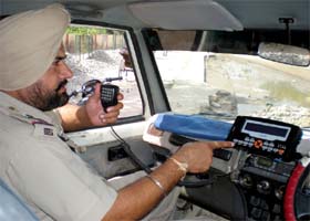 Civil Lines SHO Buta Singh showing the newly-installed AVTS gadget in his official vehicle, in Bathinda