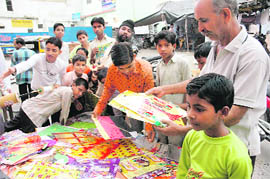 Children buy kites on the occasion of Raksha Bandhan in Dehradun on Tuesday.