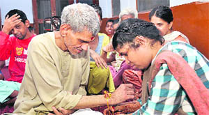 Inmates of Cheshire Home celebrate Raksha Bandhan in Dehradun on Tuesday.