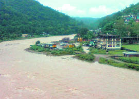 The swelling Soan khad that threatens the upcoming bus stand in Dharampur (Mandi).