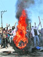 Kashmiri protesters hold a demonstration on the outskirts of Srinagar city against the killing of civilians by security forces.