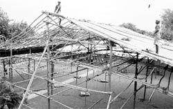 abourers construct a pandal ahead of Punjab CM Parkash Singh Badals visit