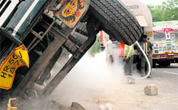 Gas being transferred to a tanker after one of them overturned on the