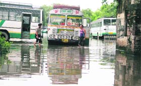 The flooded yard of the State Road Transport Corporation in Jammu after a downpour