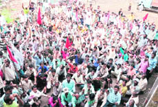 Power loom workers stage a protest in Ludhiana on Wednesday. 