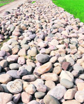  Unused boulders block the road at Kasabad village