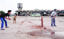 Children play cricket at modern bus stand, Rajpura. 