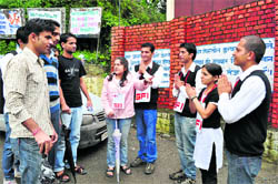 LAST PLEA: Activists of a party try to woo student voters ahead of SCA elections at Himachal Pradesh University in Shimla on Thursday.