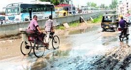 8 The entire stretch of the road along one of the arms of the newly opened ROB in Jalandhar remains full of stagnant water.