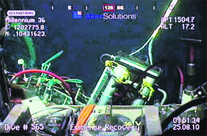 Work continues in this video grab from BP live video feed at the site of the BP Macondo well in the Gulf of Mexico.