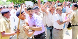 Members of the Bharatiya Janata Yuva Morcha protest against the hike in water tariff at Sector 17, Chandigarh, on Friday.