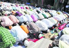Devotees offer namaaz at a mosque at Jwalapur in Haridwar on Friday. 
