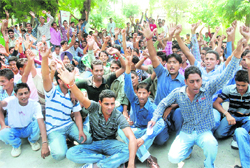 Students of the ITI hold a demonstration in front of their campus in Bathinda