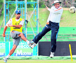 MS Dhoni (L) and Virender Sehwag play with a football