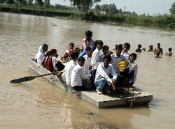 Students from Tahni Natha Singh Wala going back to their village after attending school in neighbouring villages on Saturday