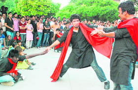 Students of the University Institute of Engineering and Technology present a play based on global warming at the Sector 17 Plaza in Chandigarh on Saturday.