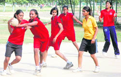 A handball match in progress on the first day of Inter-Block Rural Games at Polo Ground in Patiala on Saturday.