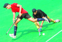 Players in action during a hockey match at the Sector 42 hockey stadium, Chandigarh.