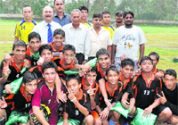 KV (IMA) team celebrate after lifting the District u-18 Football Tournament in Dehradun