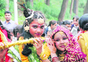 Two girls posed as Lord Krishna and Radha during a procession that was held ahead of Janmashtmi in Shimla on Saturday.