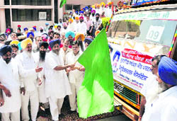 Deputy Chief Minister Sukhbir Singh Badal flags off relief material for the cloudburst victims in Leh, in Ludhiana on Saturday
