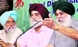 (Right to left) Chairman, Punjab Mandi Board, Ajmer Singh Lakhowal, agricultural economist Ranjit Singh Ghuman and BKU (Rajewal) president Balbir Singh Rajewal at a panel discussion on the states agriculture at the Chandigarh 
