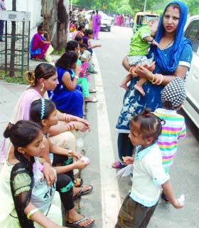 People wait for going to Bangla Sahib Gurdwara at Tolstoy Marg in New Delhi