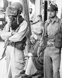 Policemen in Srinagar maintain vigil as protesters defy the curfew