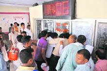 A heavy rush of passengers at an inquiry booth at Jammu Railway Station following the cancellation of 14 trains on Sunday. 