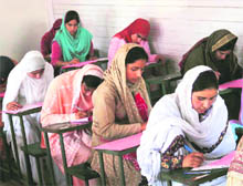 Candidates appear in the common entrance test for professional courses in Srinagar on Sunday.