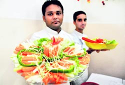 Students display their salad preparations at Ivanna Institute of Hotel Management in Ludhiana on Sunday.