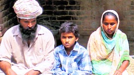Tej Partap Singh with his parents before leaving for the hospital at Nizampur near Ahmedgarh on Sunday.