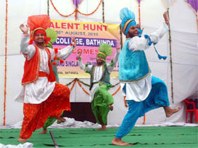 Students performing bhangra during the talent hunt at the DAV College in Bathinda on Monday. 