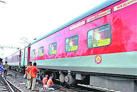 Railway workers inspect the track near Baruipara in Hooghly on Monday.