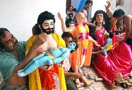 Artists from West Bengal giving finishing touches to the idols of Lord Krishna at Chaitanya Goria Math Mandir in Bathinda on Tuesday. The idols will be displayed on the occasion of Janmashtami