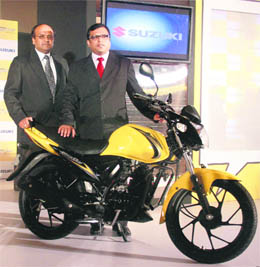 Suzuki Motorcycles India Pvt. Ltd's head of sales Vipul Goel (L) and head sales (India) Anand Singh Thakur pose with the new Suzuki Slingshot bike at its launch in Mumbai on Tuesday.
