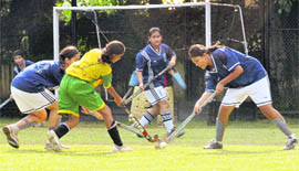 Girls in action during a match of Inter-School Hockey Tournament in Dehradun on Tuesday.