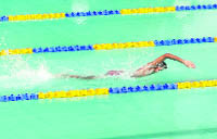 A cadet participates at the Inter-Section Swimming Competition at RIMC in Dehradun on Tuesday. 